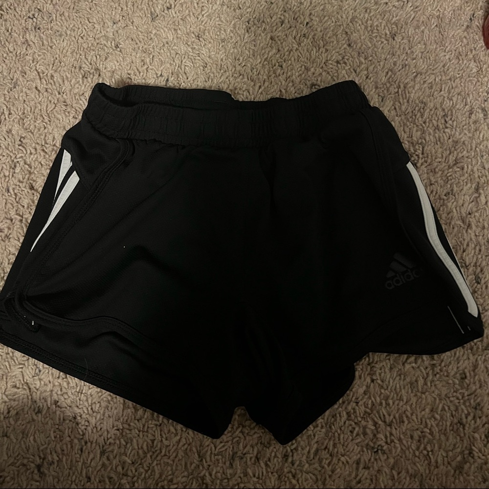 Adidas black athletic shorts in good condition.